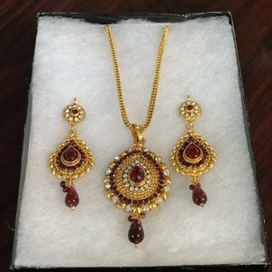 Red stone and diamond  pendant and matching earrings set with gold necklace